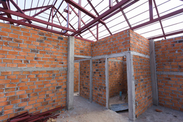 Fototapeta na wymiar structural steel beam on roof and brick wall of building