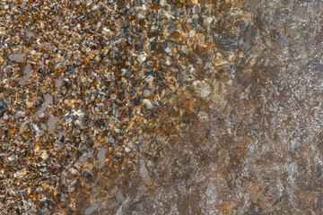 Sea pebble under water. Backgrounds and textures