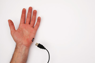 Hand with USB port and cable. Unplug from online world concept.