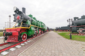 Obraz premium Old steam locomotive on cloudy sky background. Nizhniy Novgorod, Russia. 