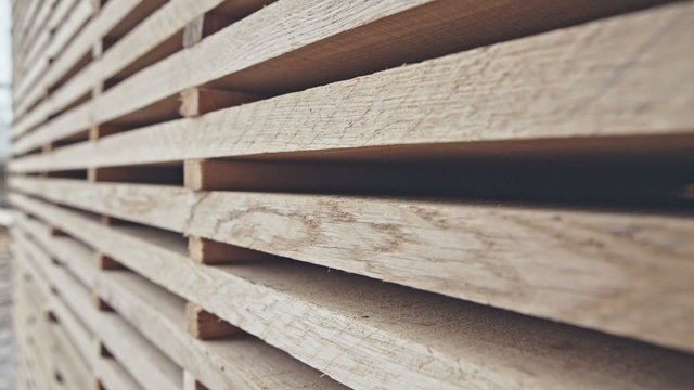 Stacked wood pine timber for furniture production and construction. RAW video record.