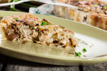 Slice of tart with chicken amd mushrooms