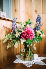 Fototapeta na wymiar bouquet of peonies and lupine
