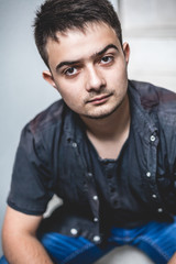 Young handsome man in unbuttoned shirt