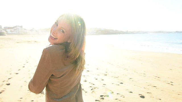 Beautiful woman walking on the beach