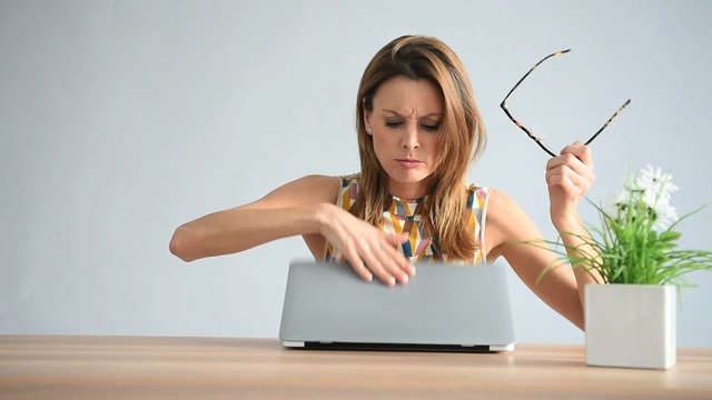 Businesswoman being upset in front of latpop