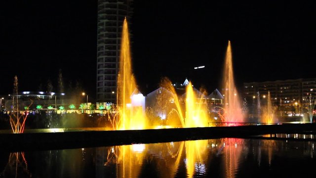 Night view of the dancing fountains and House of Justice.Colorful spectacle in the city center of Batumi