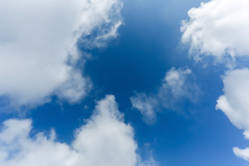 fluffy cloud above blue sky background