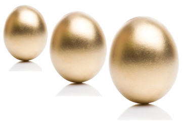 Golden eggs from  isolated on a white background. 