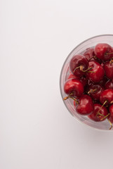 Some cherrys in a glass