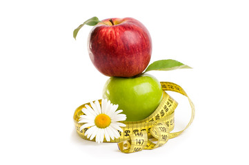 Apples, flowers and measuring tape. 