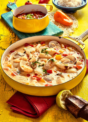 Savory Seafood Dish on Yellow Table with Garnishes