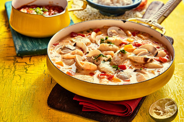 Savory Seafood Sauce on Yellow Table with Garnish