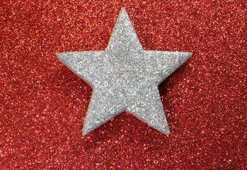 one silver star shining bright red luminescent background