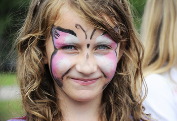 Funny little girl with painted face