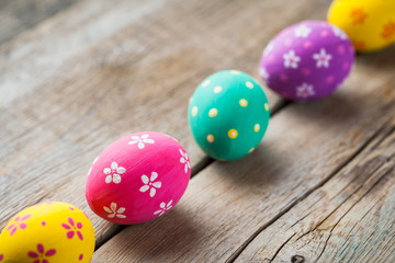 Fototapeta na wymiar Colorful eggs on kitchen table.