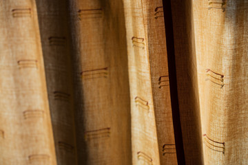 Detail of backlit curtain at sunset