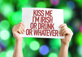 Kiss Me Im Irish Or Drunk Or Whatever placard on bokeh background