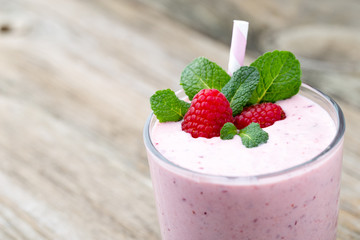 Raspberry milk shake with mint decor.