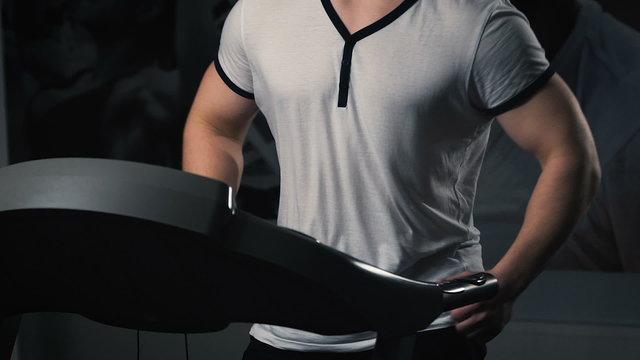 Man On Running Machine In Gym