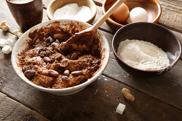 Preparing dough for chocolate pie on table close up