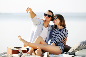 Young couple on the riverside