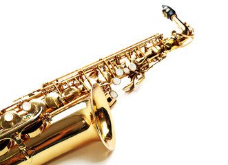 Golden saxophone isolated on white background, close up