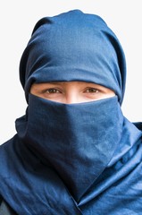 Naklejka premium Head of young woman veiled with blue niqab scarf. Isolated on white background.