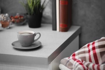 Cup of coffee on the kitchen table, close up