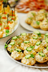 Dish with assorted snacks on a table