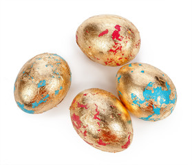 gold eggs on white background.