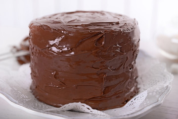 Tasty chocolate cake on light background