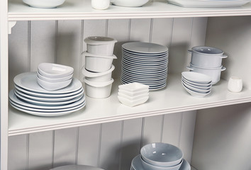 Dishes in cupboard in the kitchen