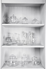 Obraz na płótnie Canvas Glass dishes on shelves in the kitchen