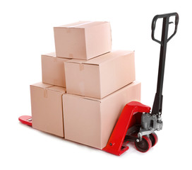 Fork pallet truck with stack of cardboard boxes isolated on white