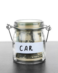 Jar for savings full of banknotes