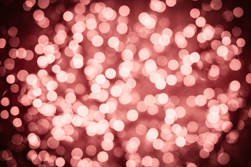 Marsala background with natural bokeh defocused sparkling lights. Colorful texture with twinkling lights. Bright and vivid colors