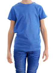 Obraz premium Clothes advertising. Boy in blue T-shirt and jeans isolated on white background, close up