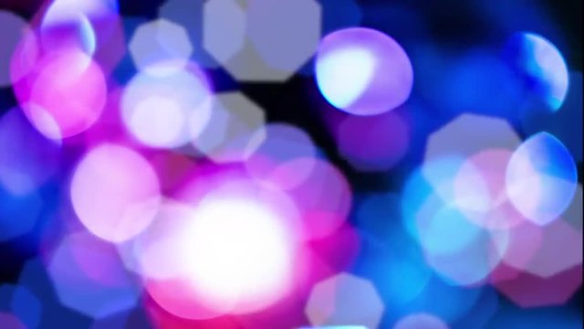 Background with bokeh defocused lights in blue pink colors from disco mirror ball.