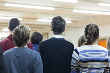 students standing at lecture