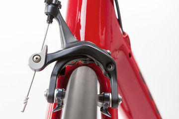 Bicycle Concept. Partial View of Professional Road Bike Wheel With Brake Calipers in Front