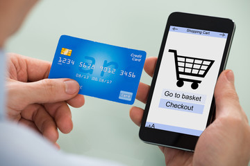 Person Shopping On Mobile Phone