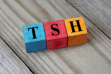 TSH (Thyroid-stimulating hormone) symbol on colorful wooden cube