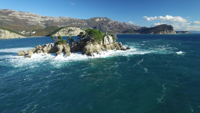 Aerial view of island with church in front of Petrovac. 