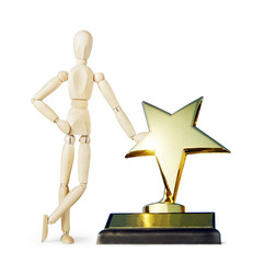 Man stands near the big golden star award. Abstract image with a wooden puppet