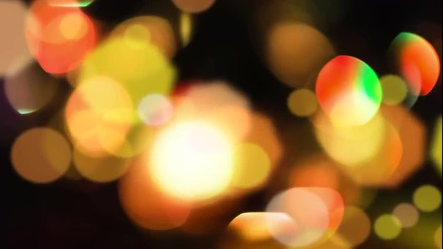 Background with bokeh defocused lights in Yellow and  orange colors from a disco mirror ball.