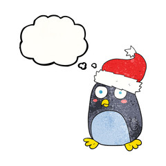 thought bubble textured cartoon penguin in christmas hat