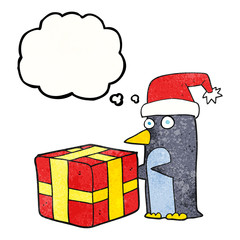 thought bubble textured cartoon christmas penguin with present