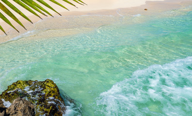 Soft wave of the tropical sea on the sandy beach. Caribbean Sea