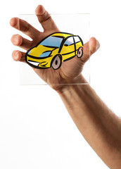 Fototapeta premium Hand holding glass picture of car
